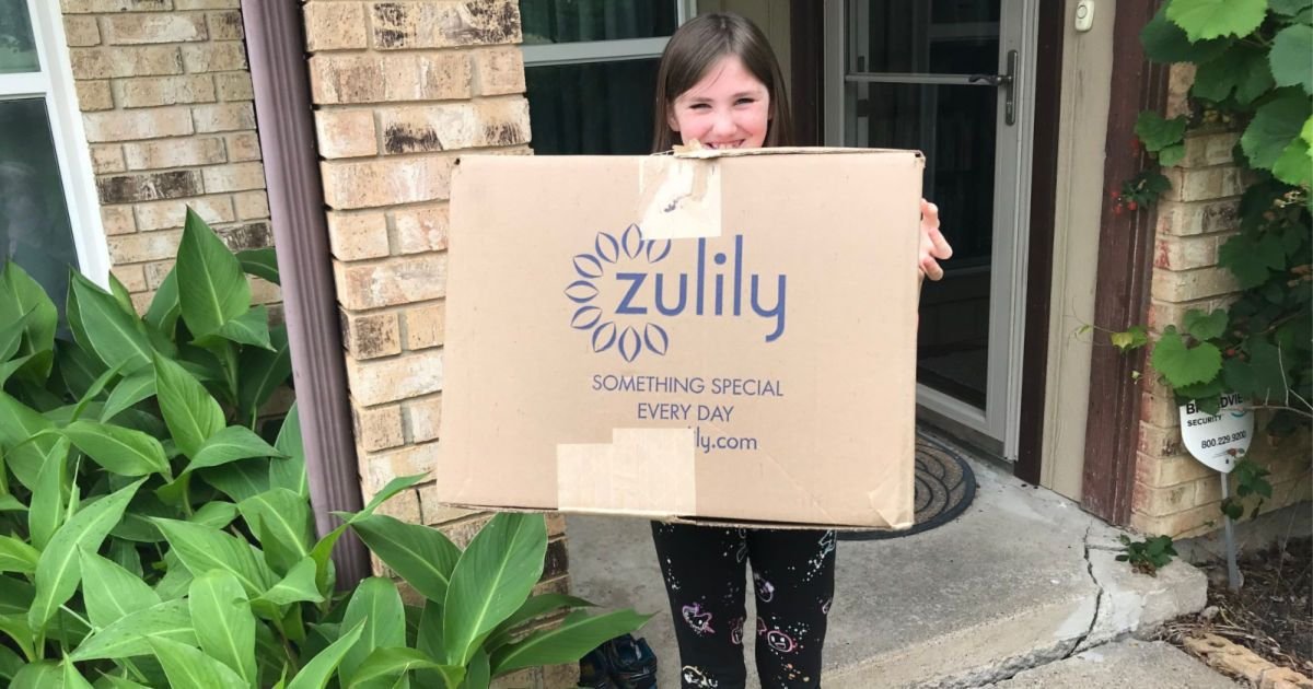 child holding big zulily box